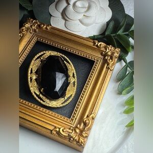 Elegant Black and Gold Brooch